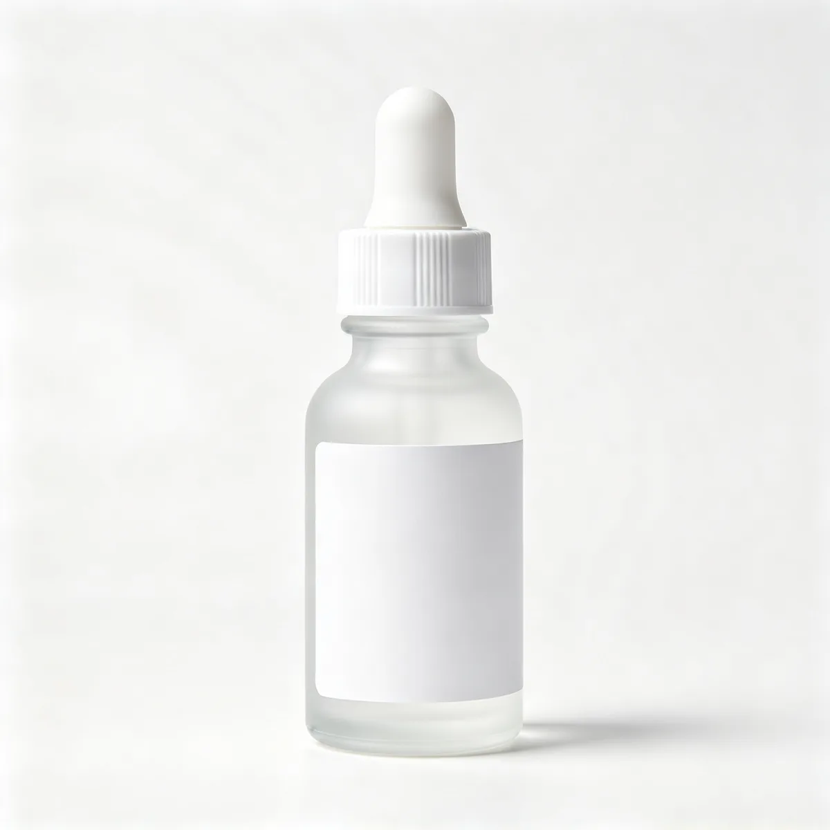 A skincare dropper bottle and a marble countertop scene merged into one product photo — Before